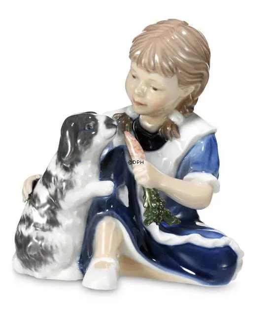 Royal Copenhagen 1249363 Girl with rubbit Porcellaine figurine and made and painted in enamel H. 11 cm